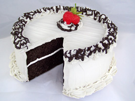 Large Vanilla Frosted Cake with Slice Removed