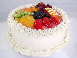Large Vanilla Frosted Cake with Fruit