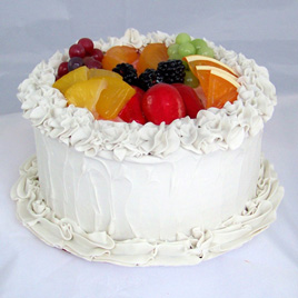 Small Vanilla Frosted Cake with Fruit
