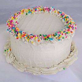 Small Vanilla Frosted Birthday Cake with Pastel Sprinkles