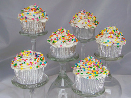 Cupcakes with Vanilla Frosting and Pastel Sprinkles