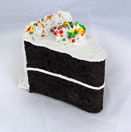 Vanilla Frosted Slice of Chocolate Cake with Primary Sprinkles