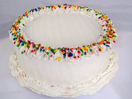Small Vanilla Frosted Birthday Cake with Primary Sprinkles