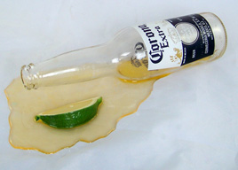 Spilled Bottle of Beer with Lime